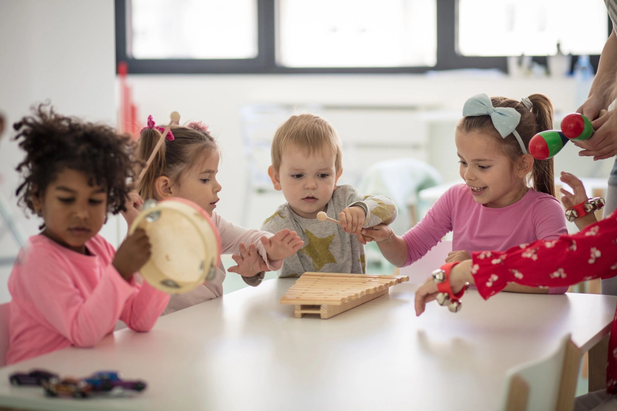 Children making music in a preschool classroom