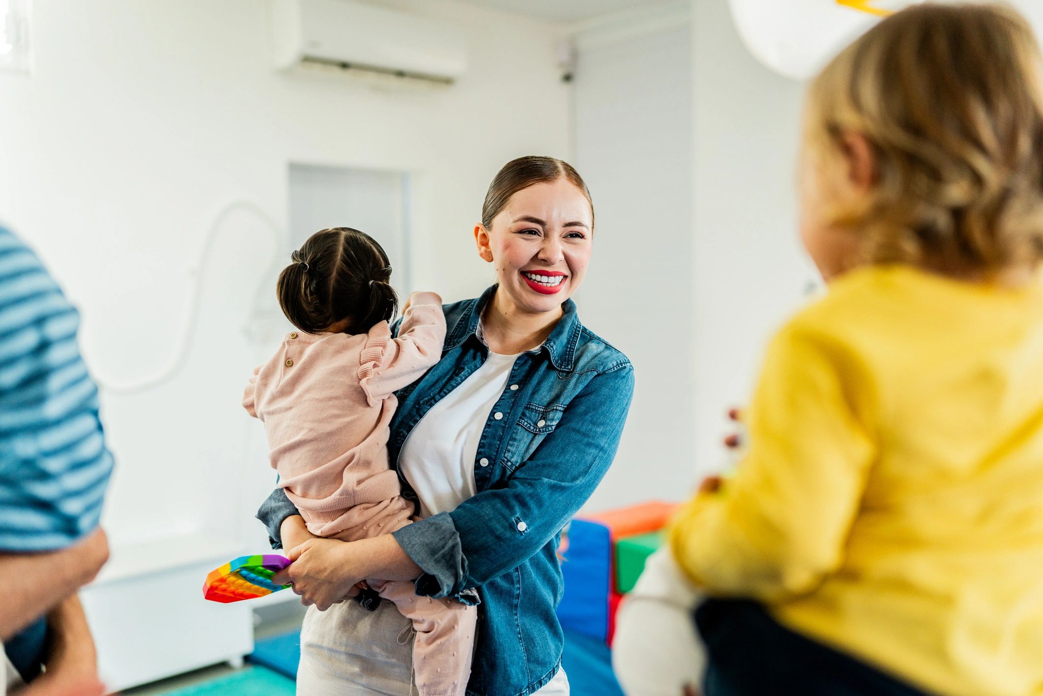 Parent holding a baby at a support group